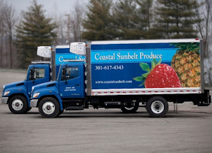 Two Coastal Sunbelt Produce trucks.